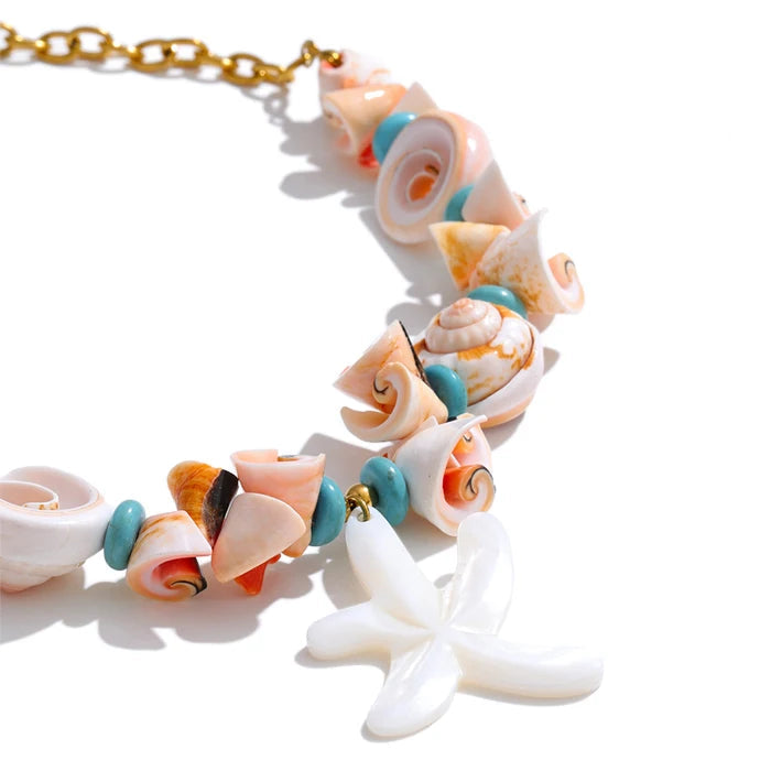 Necklace with shell and coral beads on a white background
