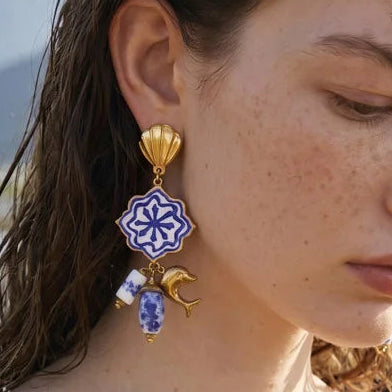 Collage of a woman wearing earrings with a scenic background