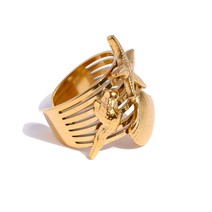Gold ring with unique design on a white background