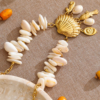 Necklace with white stones and gold accents on a beige background