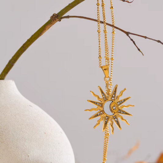Sun, moon, and shell charm necklace in waterproof gold stainless steel.