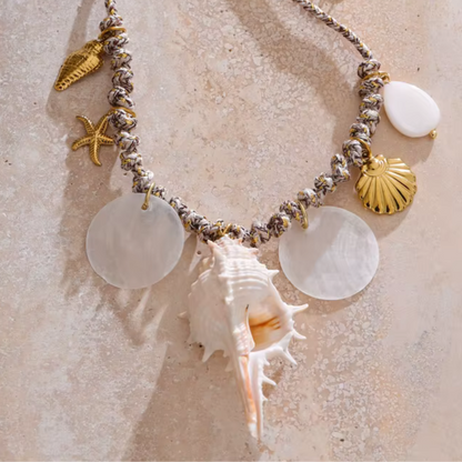 Necklace with natural conch and shell charms in 18K gold-plated stainless steel.